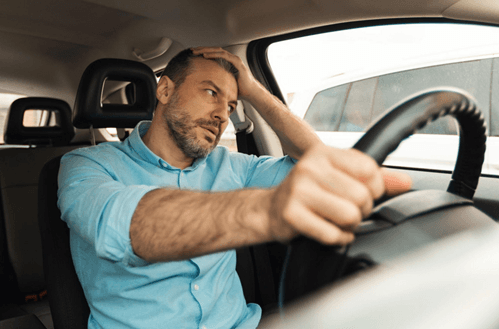 Driver reacting emotionally to frustration while driving because of automatic emotional conditioning